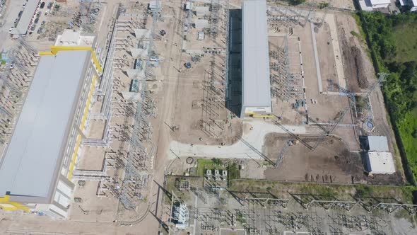 Aerial view of electricity generating, voltage poles. Power lines on utility tower and cable wires alt
