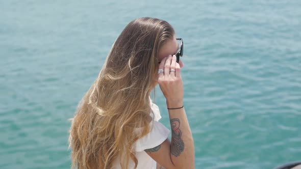 Blond Woman in Sun Glasses Looking at Beautiful Sea Bay Celebrating Scenic Landscape Enjoying alt