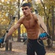 Sporty man doing exercise for hands and for all body. Workout with TRX system for pump up body - VideoHive Item for Sale