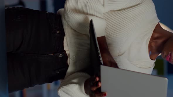 Exhausted Business Woman Holding Laptop Typing and Sighing Looking at Camera alt