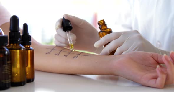 Close up of woman therapist doing allergy tests on her patient alt