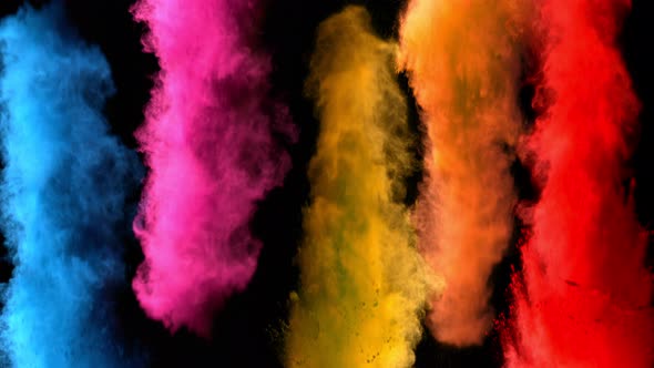 Super Slowmotion Shot of Color Powder Explosions Isolated on Black Background alt