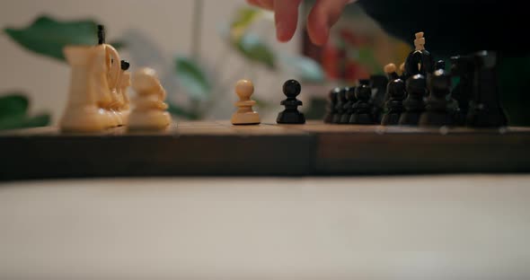 Cinematic Close Up To Hands Playing Chess at Home
