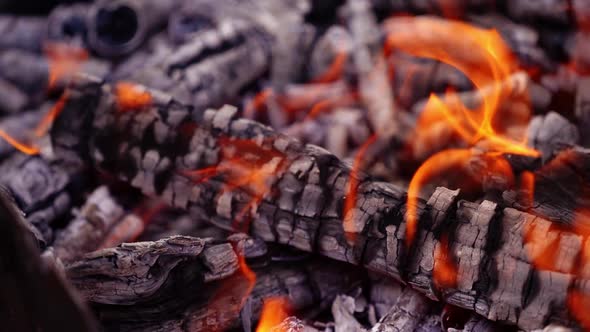 Coals are burning in the fire alt
