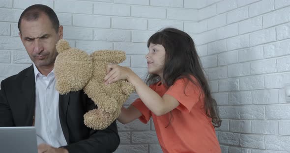 Man Working with Playful Child alt