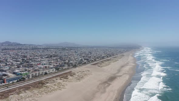 Descending and panning aerial shot of Ocean Beach in San Francisco. 4K alt
