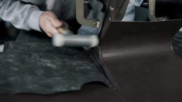 Close Up Pf a Tinsmith Blacksmith Hands Use Hammer Working in His Workshop alt