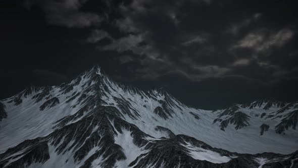 Mountains in Evening Cloudy Sky alt