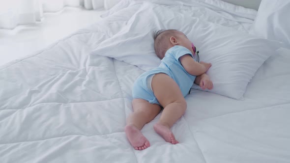 Family concept. The baby is sleeping in the bedroom. 4k Resolution. alt