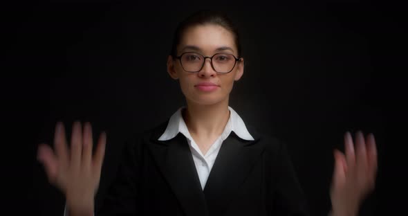 Business Woman with Glasses with a Serious Face Shows Eight Finger