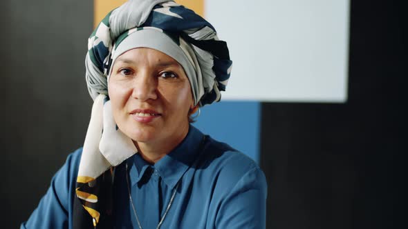 Mature Muslim Woman Posing in Studio alt