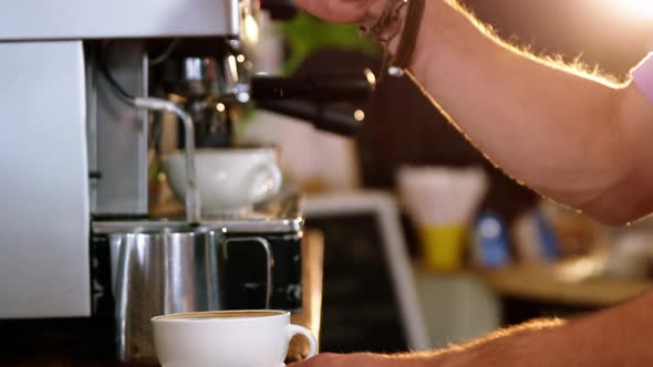 Waiter making cup of coffee alt