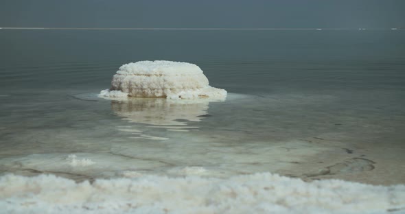 Tracking shot of salt deposits on the banks of the Dead Sea in israel alt
