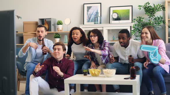 Excited Sports Fans Enjoying Game on TV Laughing and Doing High-five in Flat alt