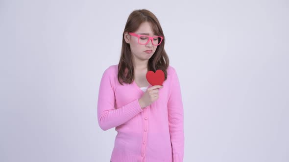 Young Sad Asian Nerd Woman Getting Surprised for Valentine's Day alt