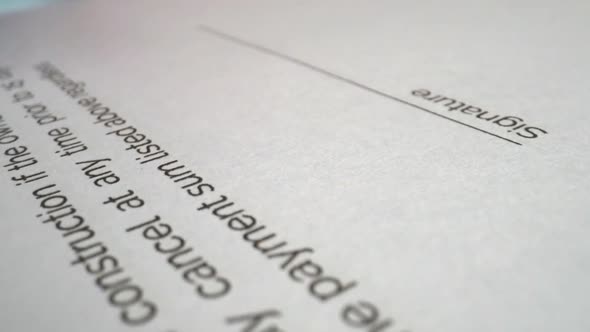 Businessman sign signature on document contract paper at office desk alt