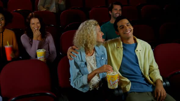 Couple watching movie in theater 4k alt