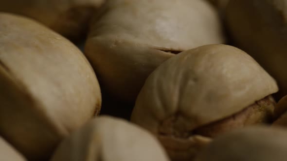 Cinematic, rotating shot of pistachios on a white surface - PISTACHIOS 019 alt