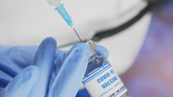 Doctor Takes COVID19 Vaccine Into Syringe