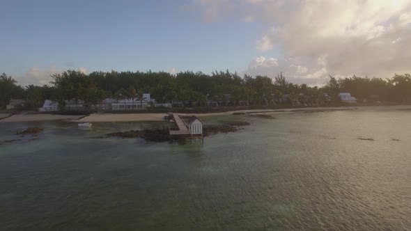 Aerial View of Ocean Blue Water with Waves, Corals and Water Plants, Camera Moving To Coast alt