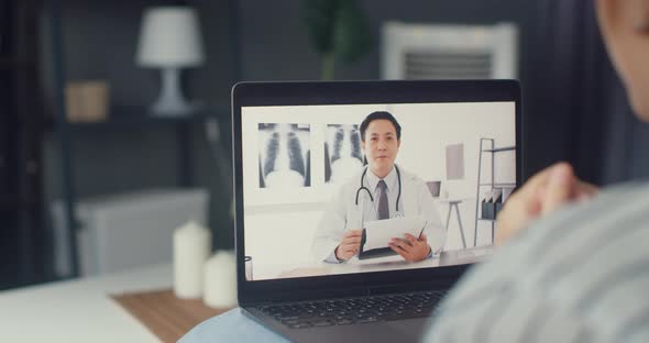 Asia girl using computer laptop talk about disease in video conference call with senior doctor.