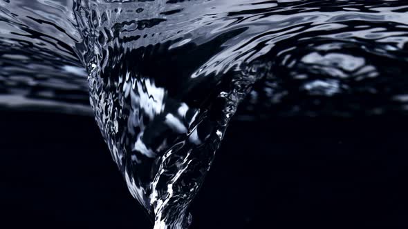 Super Slow Motion Shot of Water Whirl Isolated on Black Background at 1000Fps alt