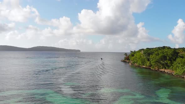 Coast View With A Boat Passing By