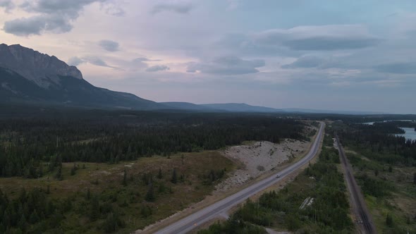 Open stretch of road winding through the epic Rocky Mountains in the stunning Kananaksis Country reg alt