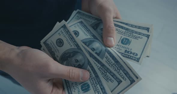 Man Counting Dollars alt