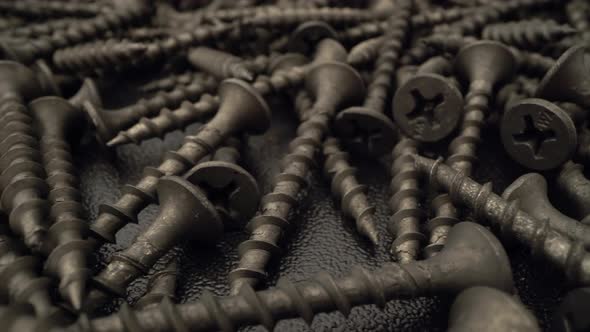 A Handful of Screws Are on the Table alt