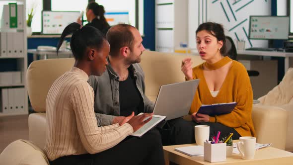 Multiethnic Business Team Brainstorming on Project During Start Up Meeting alt