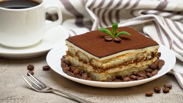 Portion of Traditional Italian Tiramisu dessert, cream or milk and cup of espresso coffee alt