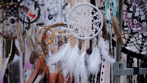 Many Different Amulets Dreamcatcher Swinging in the Wind