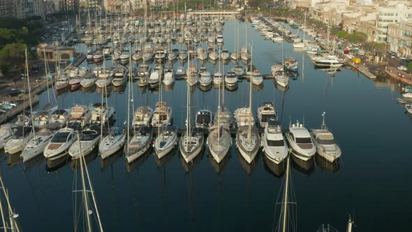 Yachts and Sailboats in Harbour, Aerial Top Down View in Sunlight alt