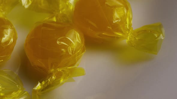 Rotating shot of butterscotch candies alt