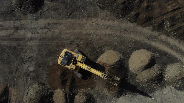 Aerial view of the excavator on the construction site. alt