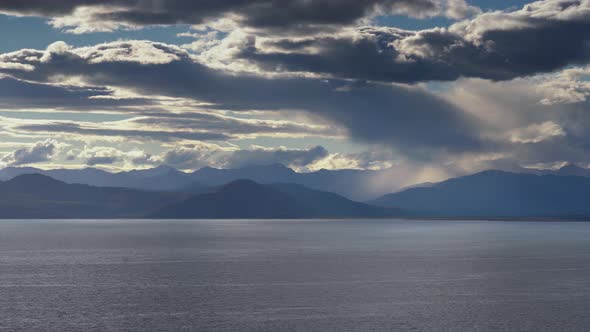 Thunderclouds Illuminated by Rays of Sun, Floating Across Sky