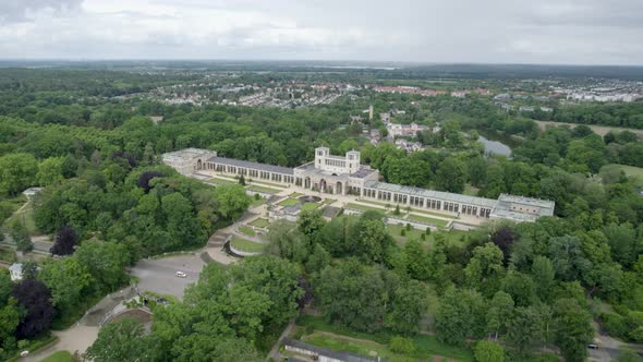Aerial Shot Of Orangerieschloss Castle In Potsdam, Germany In Green Forest. alt