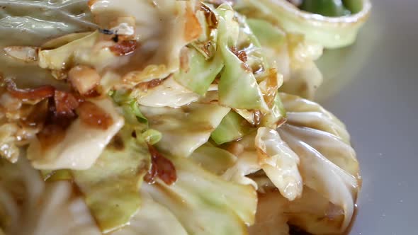 Close Up Footage of Stir Fried Cabbage and Fish Sauce, One of Thailand Famous Dish alt