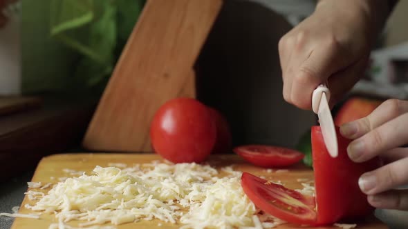 Slices of Cheddar and Colby Cheese Disappearing From a Stack on a Cutting Board Stop Motion