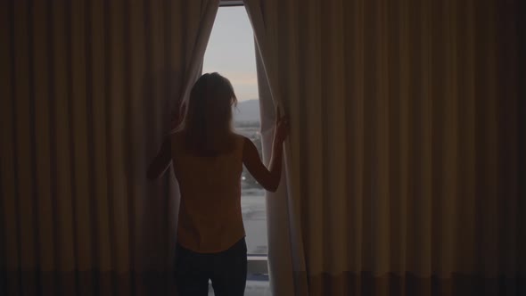 Woman Opens Curtains alt