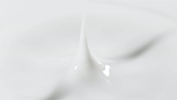 Super Slow Motion Detail Shot of Fresh Milk Drop at 1000 Fps alt