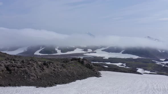 The Magma Stone Field of Gorely Volcano Covered with Fog