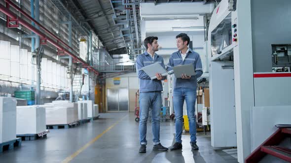 specialist worker engineer team control and operate printing package lable machine alt