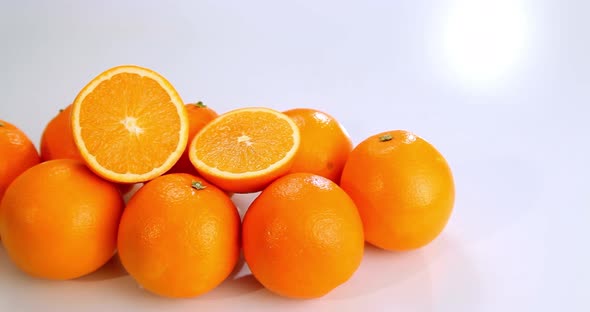 Fresh Oranges Moving Slowly White Background.