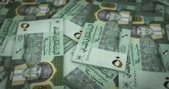 Oman Rial growing pile of money seamless loop alt