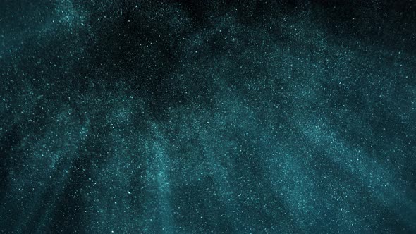Super Slow Motion Shot of Blue Glittering Atmospheric Particle Background on Black at 1000 Fps alt
