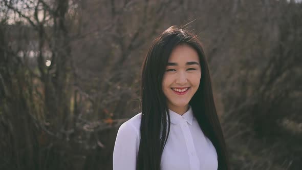 Beautiful Thai Girl Is Looking at Camera and Smiling Cutely. Teen Happy and Kind alt