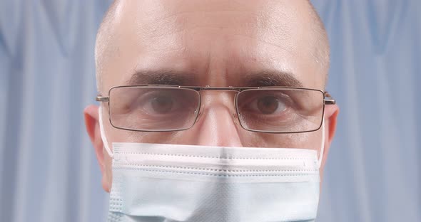 A Masked Doctor Wears Glasses alt