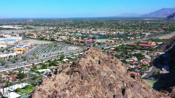 Pride of American flag waving at Indio Coachella Califronia mountain top alt